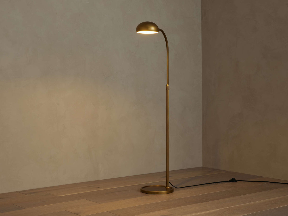 Side view of brass floor lamp for scale and shape reference