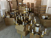 Chandelier parts and finishes staged for assembly
