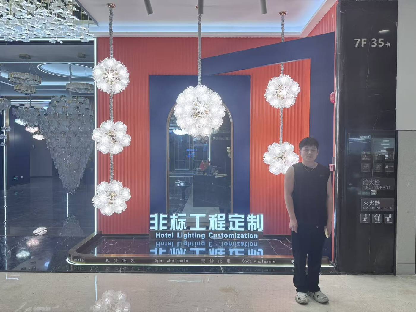 Custom lighting display showing chandelier and project lighting support